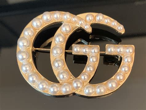 Designer Gucci Brooches .